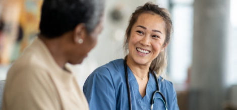Doctor talking to elderly patient